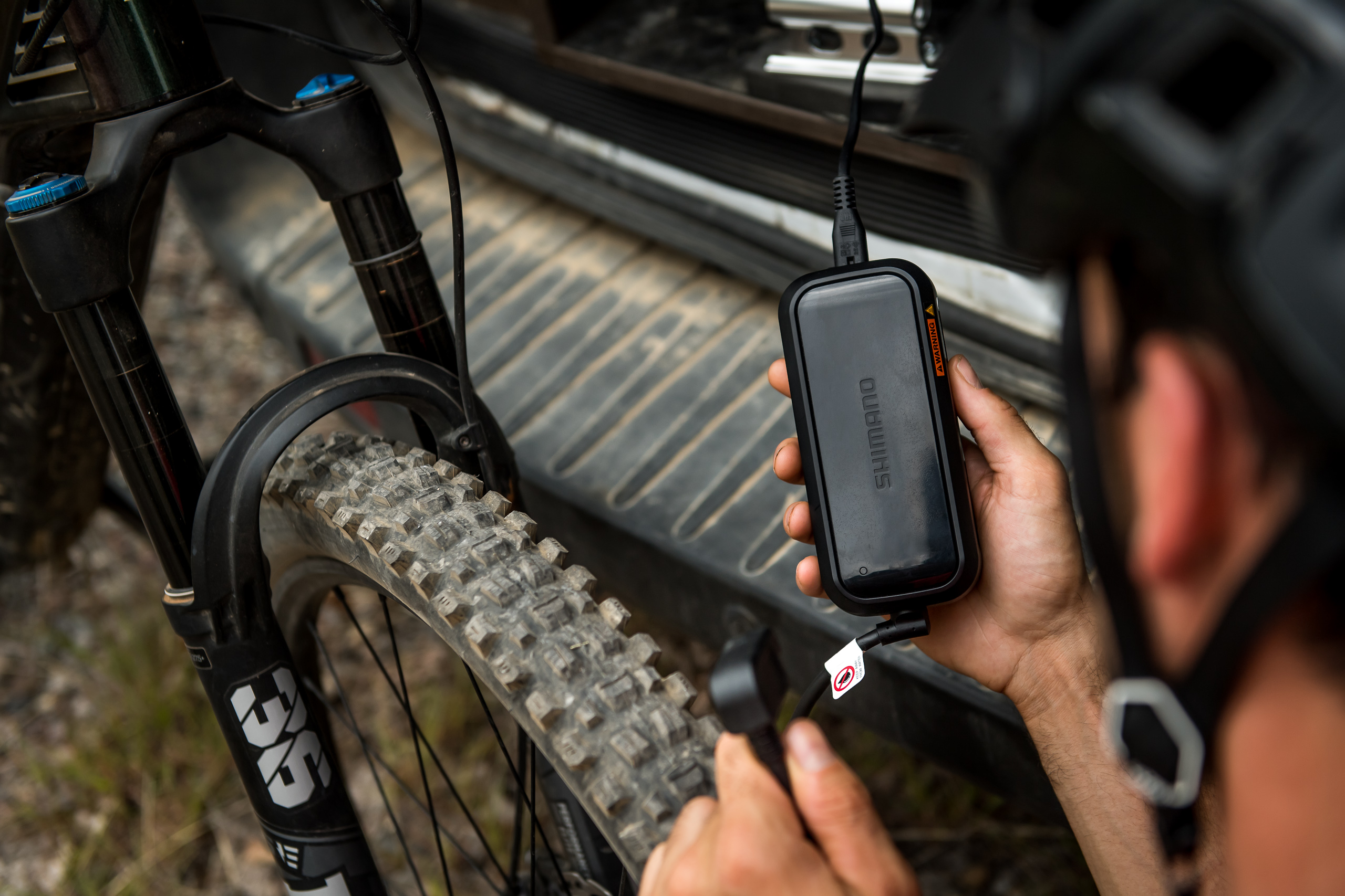 Shimano EP8 e-bike smart charger being used on an emtb bike