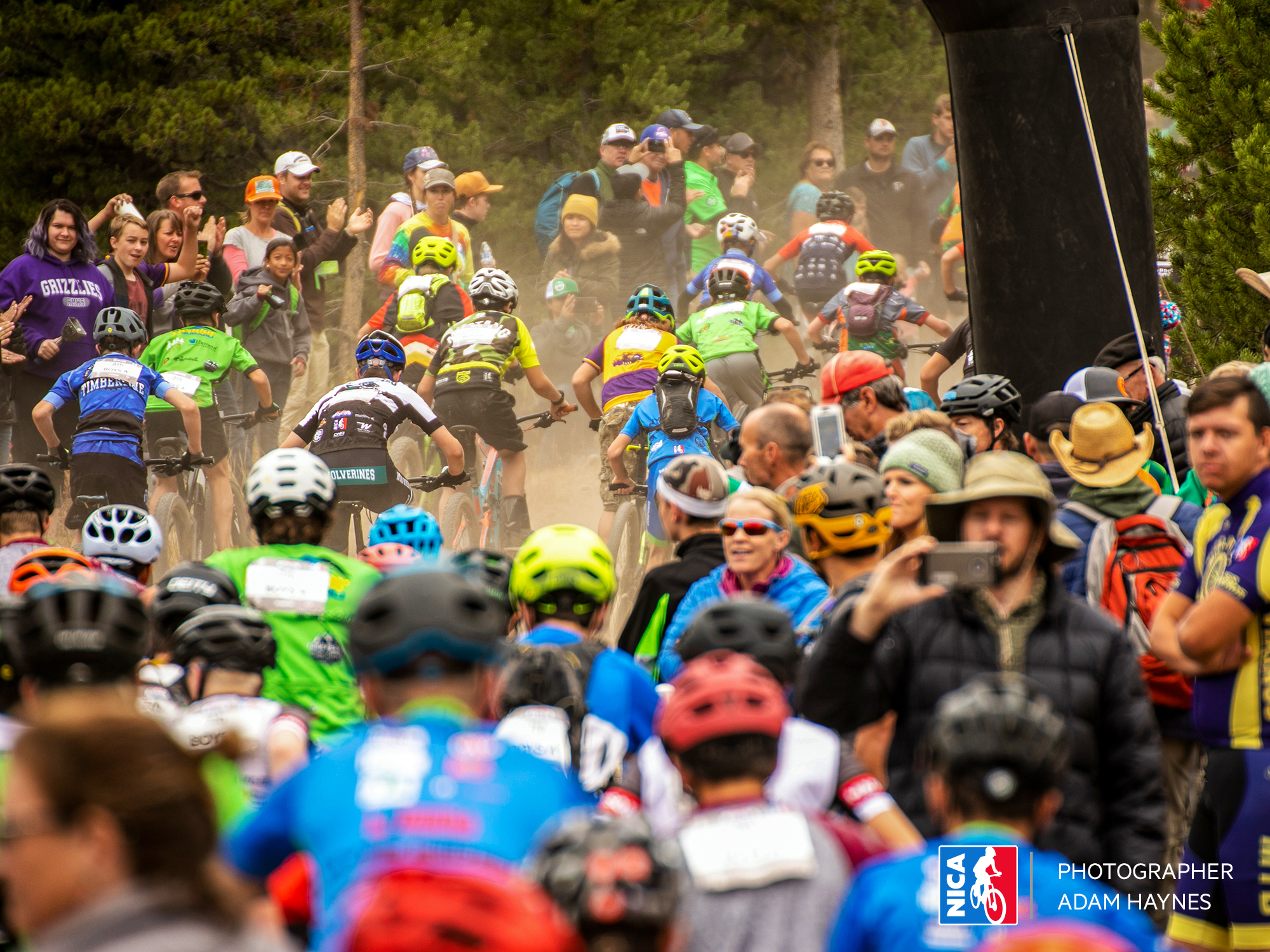 People watching a high school NICA mountain bike race